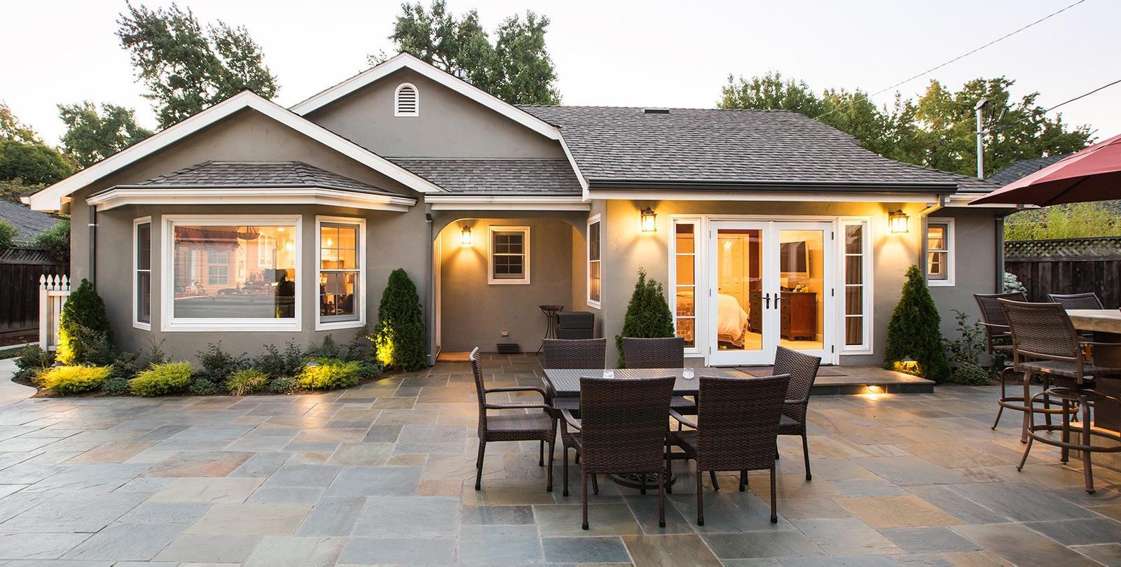 Modern home exterior with stylish siding, energy-efficient roofing, and bold paint colors enhancing curb appeal.