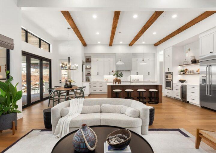 Bright and spacious open floor plan home featuring a seamless kitchen, dining, and living area with modern decor.
