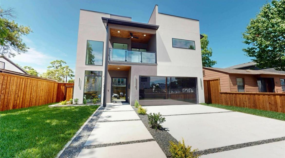 Modern villa remodel featuring smooth finish and minimalist landscaping