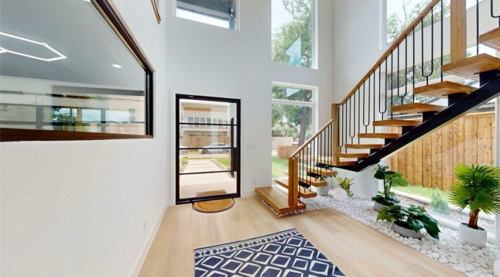 Contemporary entry remodel with open stairs and indoor landscaping