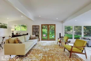 This open, airy living room showcases the results of a home remodel in Austin, offering a stylish and comfortable space for relaxation and entertaining.