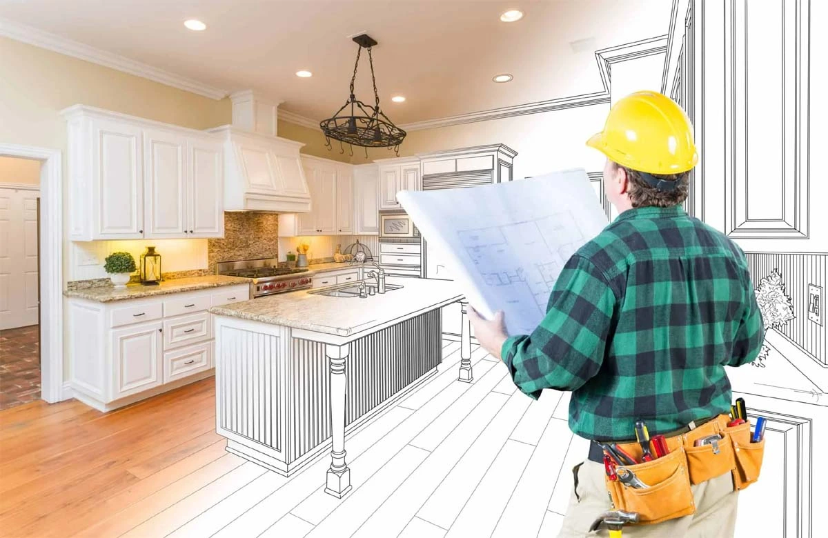 Austin remodeling contractors reviewing kitchen blueprints to create a fully customized cooking space with premium cabinetry and finishes.