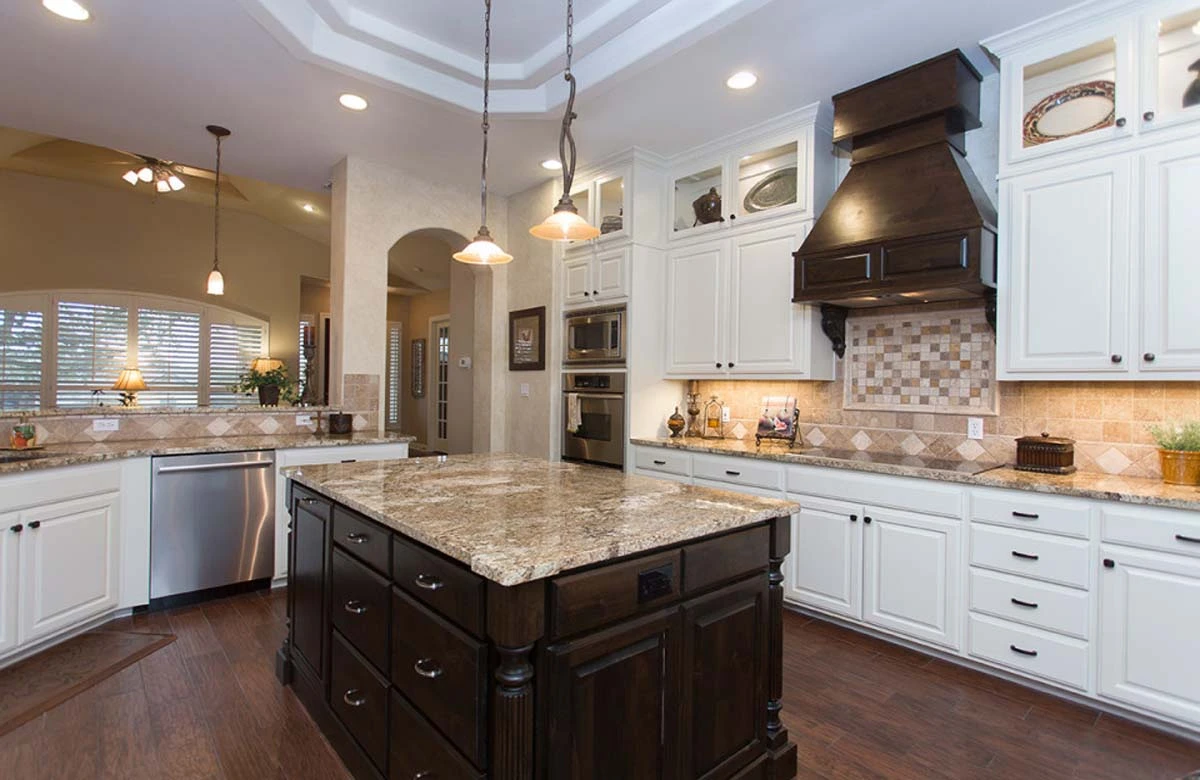 Plan your kitchen remodel in Austin Texas: full checklist highlights modern cabinetry, minimalist hardware, and natural wood tones.