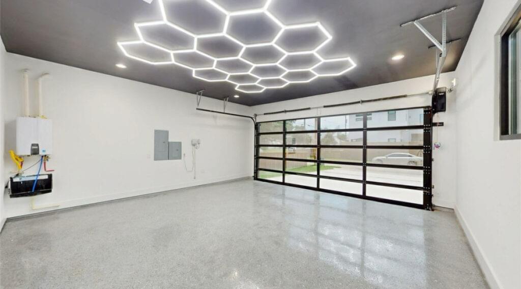 Remodeled garage with epoxy flooring and LED ceiling lights